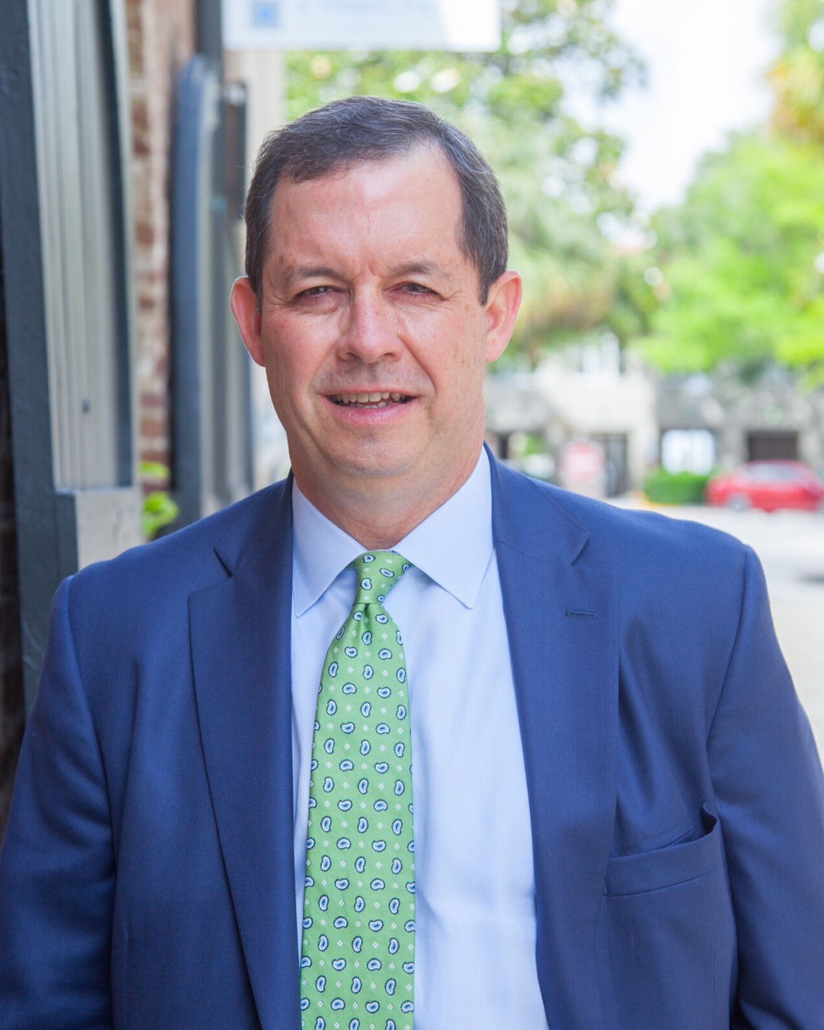 Rep. Robby Robbins outside a brick building in downtown Charleston